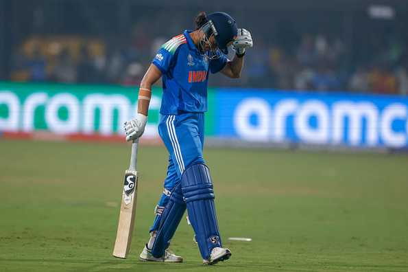 Mandhana reacts after being dismissed for 88 against England.